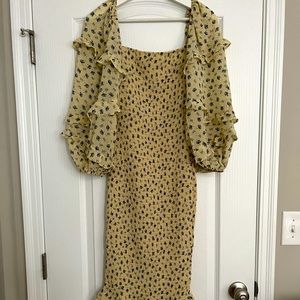 Yellow floral ruched petal and pup dress with balloon ruffle sleeve details
